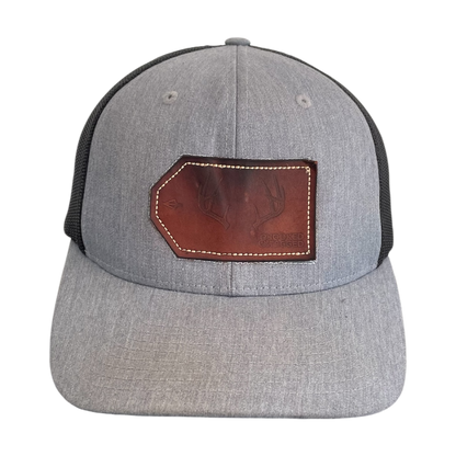 Leather patch deer trucker cap